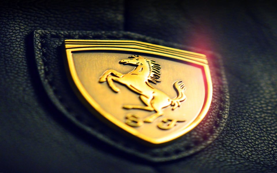 Download Gold Ferrari Logo Badge wallpaper
