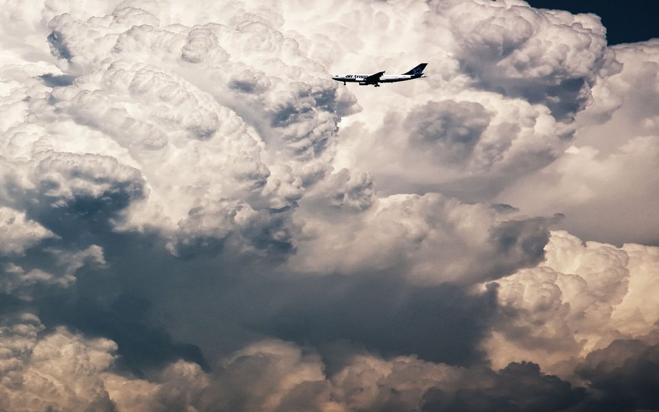 Download Single Plane Among Clouds wallpaper