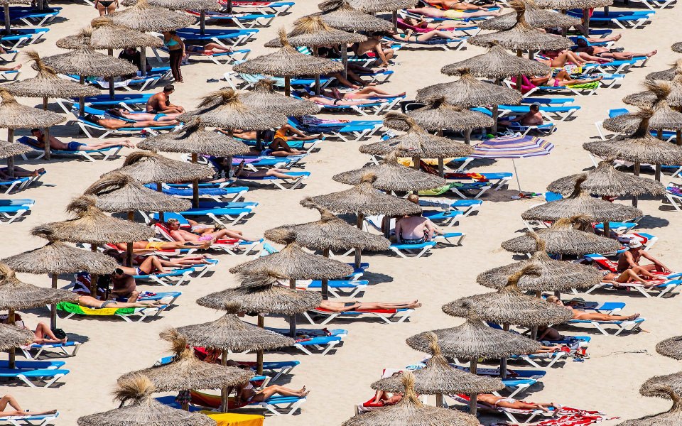 Download Straw Umbrellas On Beach wallpaper