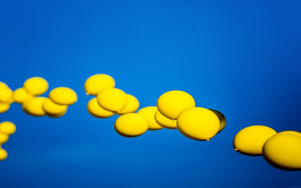 Download Yellow Balloons In Blue Sky wallpaper