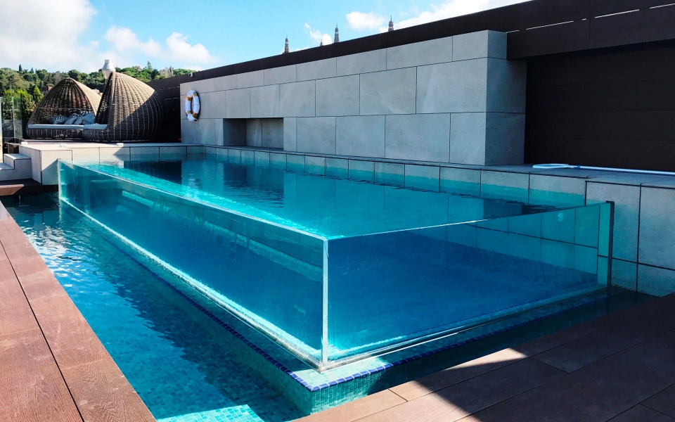 Download Elevate Your Outdoor Experience with a Glass Swimming Pool and Stylish Design wallpaper
