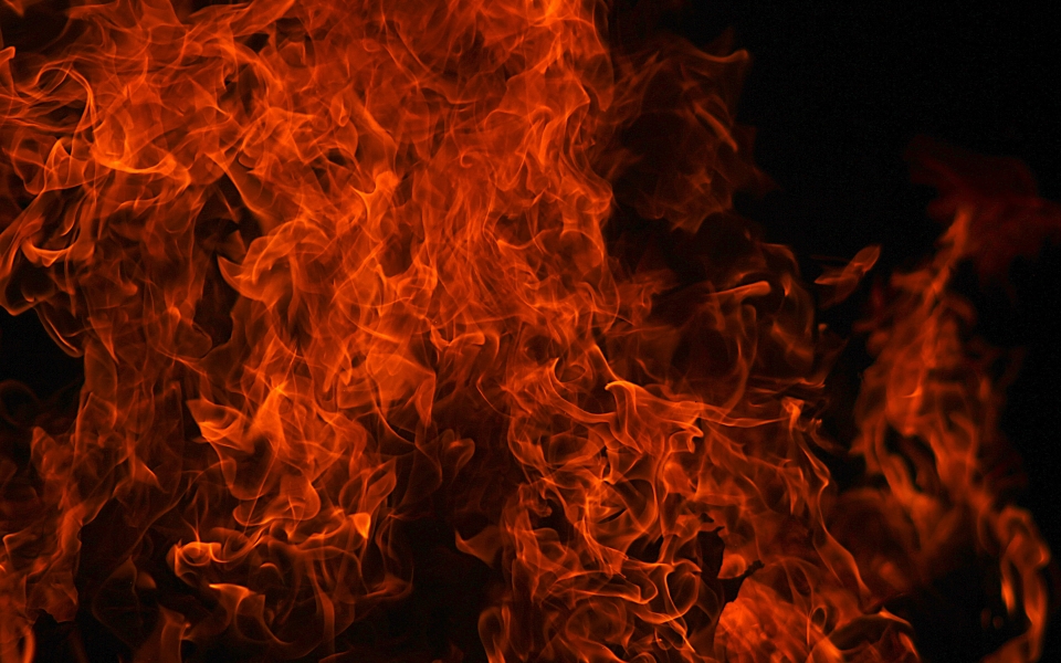 Download Fiery Close-Up HD Wallpaper of Orange Flames on Black Background wallpaper