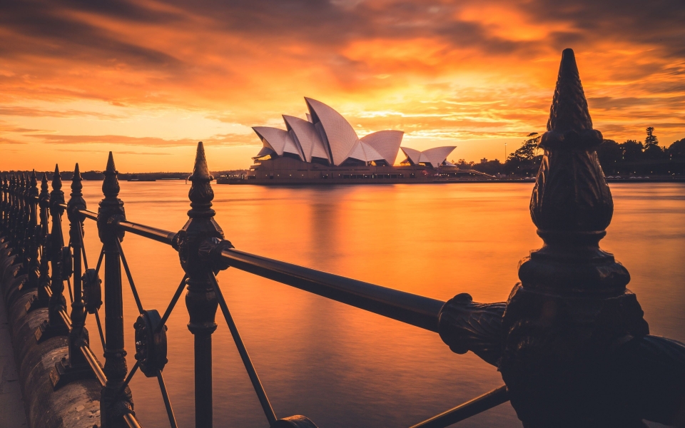 Download Experience the Iconic Beauty of Sydney Opera House at Sunset HD Wallpaper wallpaper