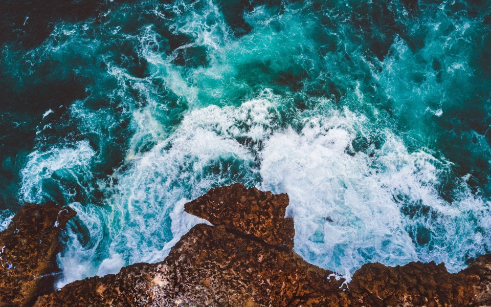 Download Ocean's Majesty Top View of Waves and Foam HD Wallpaper wallpaper