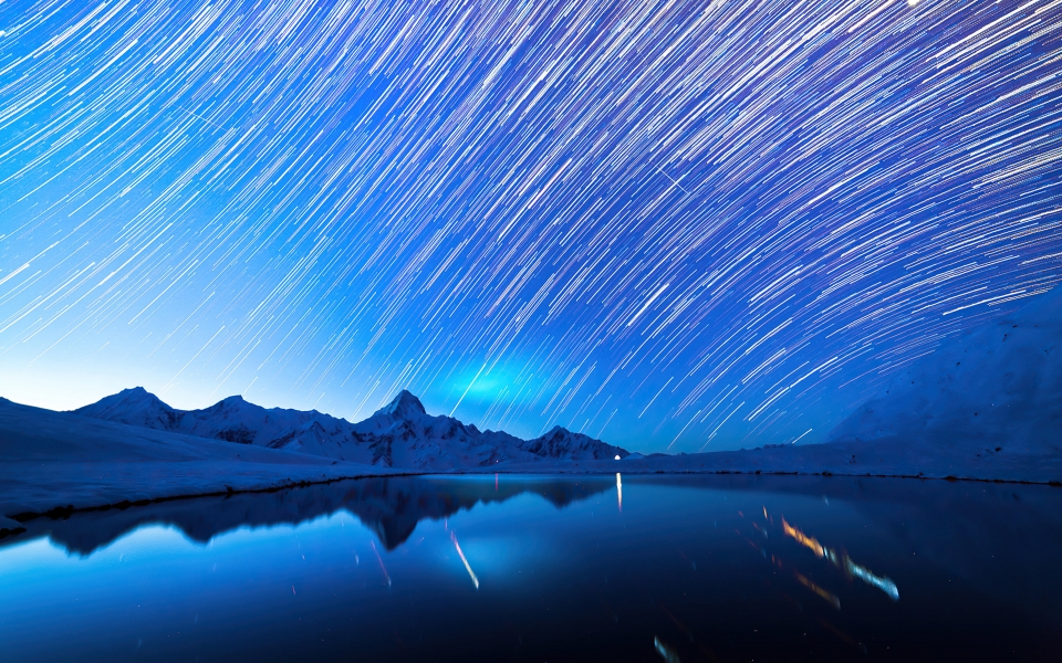 Download Star Trails Over Snowy Mountains Captivating Nighttime HD 4K 2024 2025 Wallpaper wallpaper