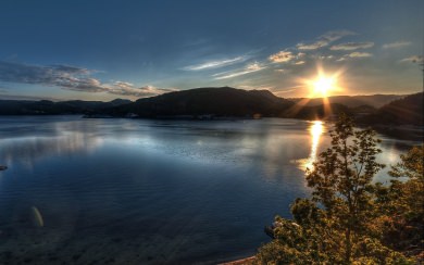 Sunset Over A Lake and Mountains