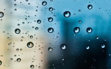 Water Droplets on Blue City Window