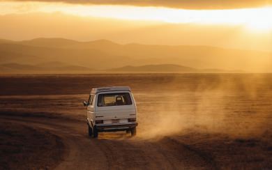 White Car Travelling Across Desert