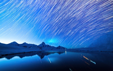 Star Trails Over Snowy Mountains Captivating Nighttime HD 4K 2024 2025 Wallpaper